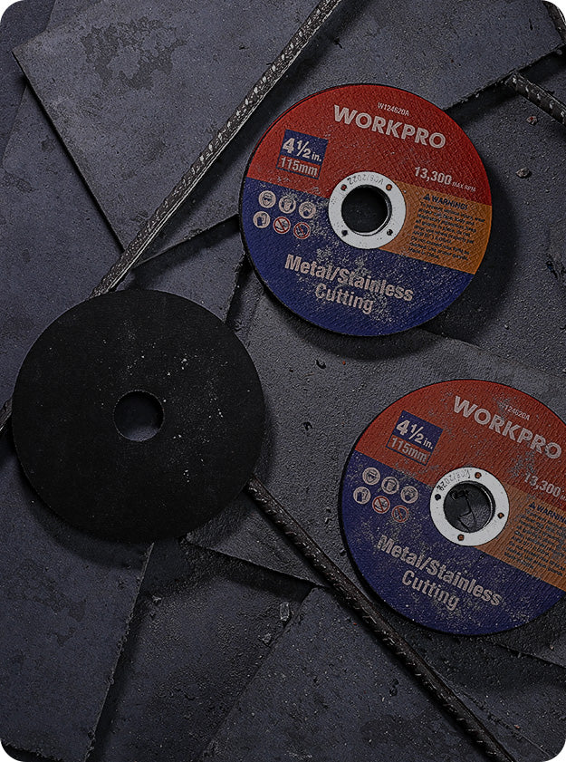 Two metal cutting discs with abrasive surfaces and center holes, alongside a black backing disc on dark metal sheets