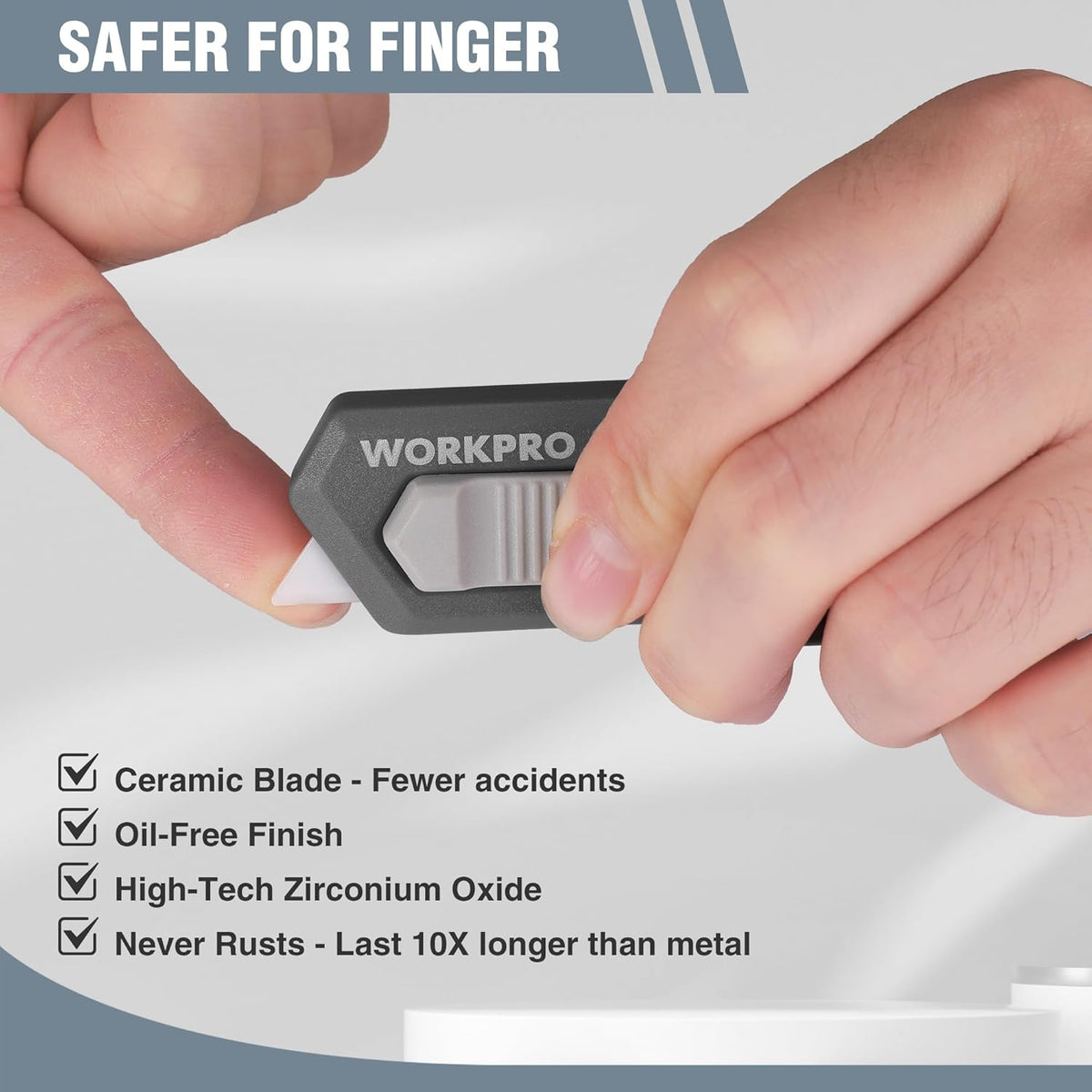 WORKPRO ceramic safety box cutter with retractable mini blade, held in hand