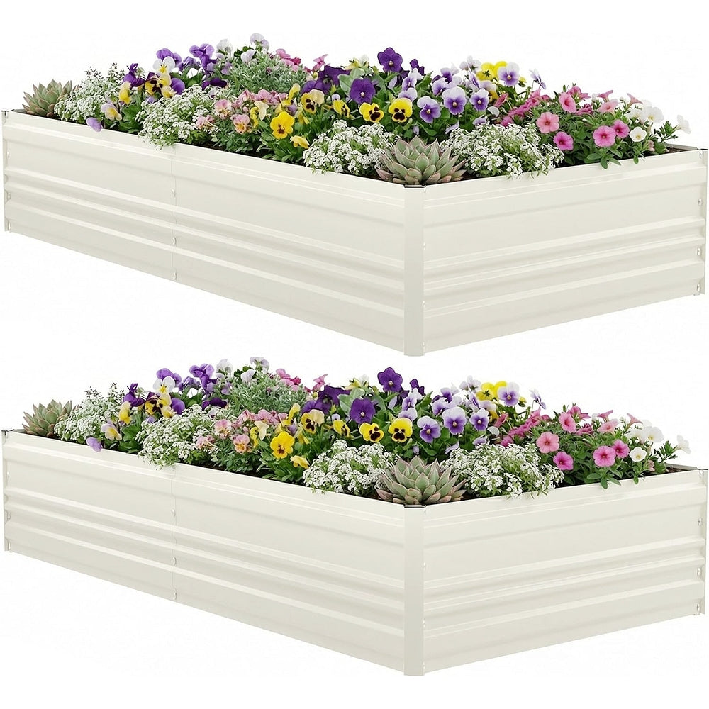 Two-tier view of a white raised garden bed filled with mixed flowers