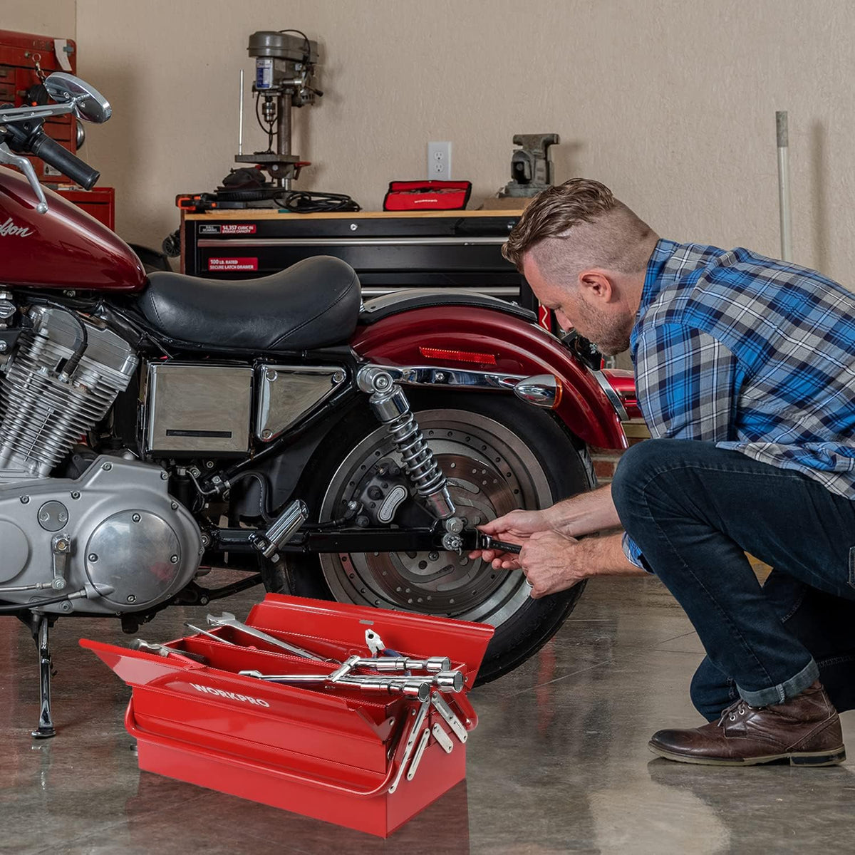 Workpro metal tool box, 18 inch cantilever folding red storage box with carbon steel construction beside a motorcycle