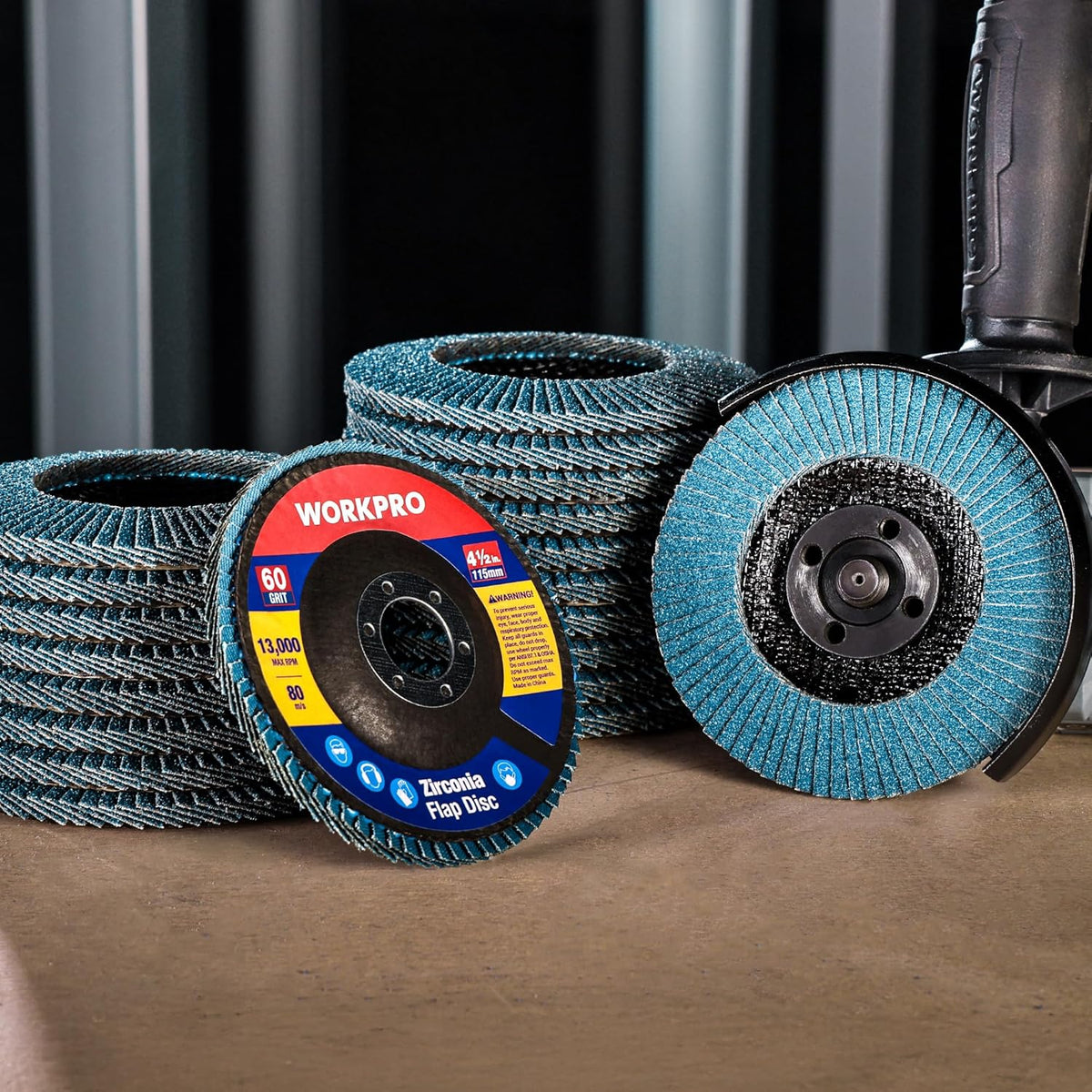 Stacked blue zirconia flap discs with black center hubs, WORKPRO labels