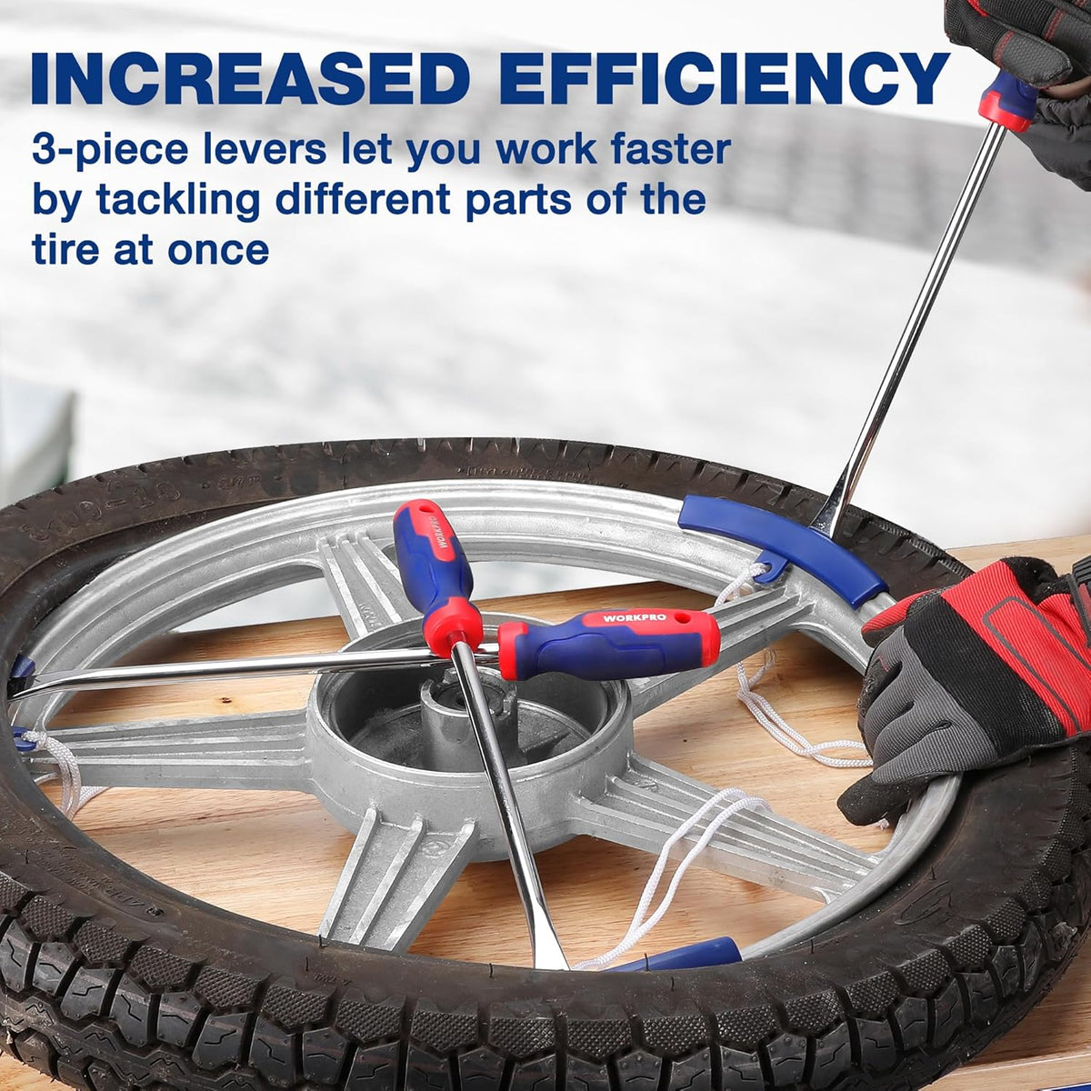 Tire iron tool set with blue-and-red tire levers and metal tire spoons on a wheel