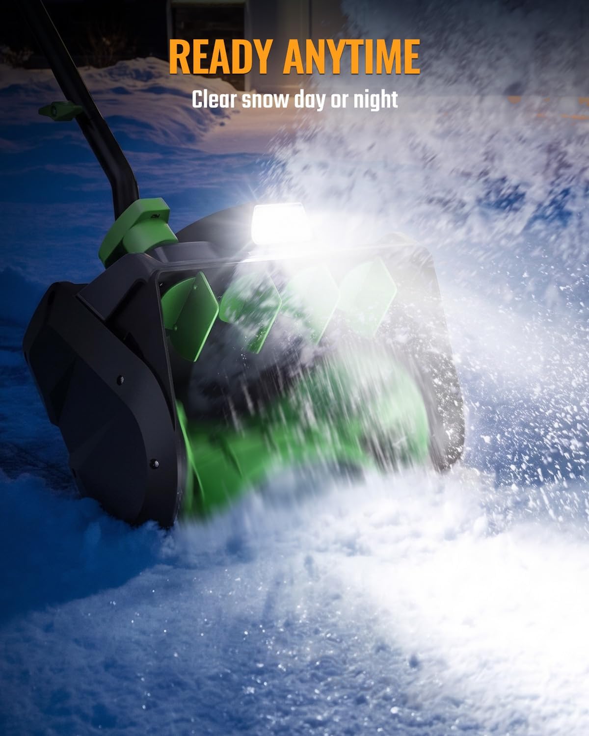 Workprox cordless electric snow shovel in green and black, clearing snow at night through a broad spray of snow.