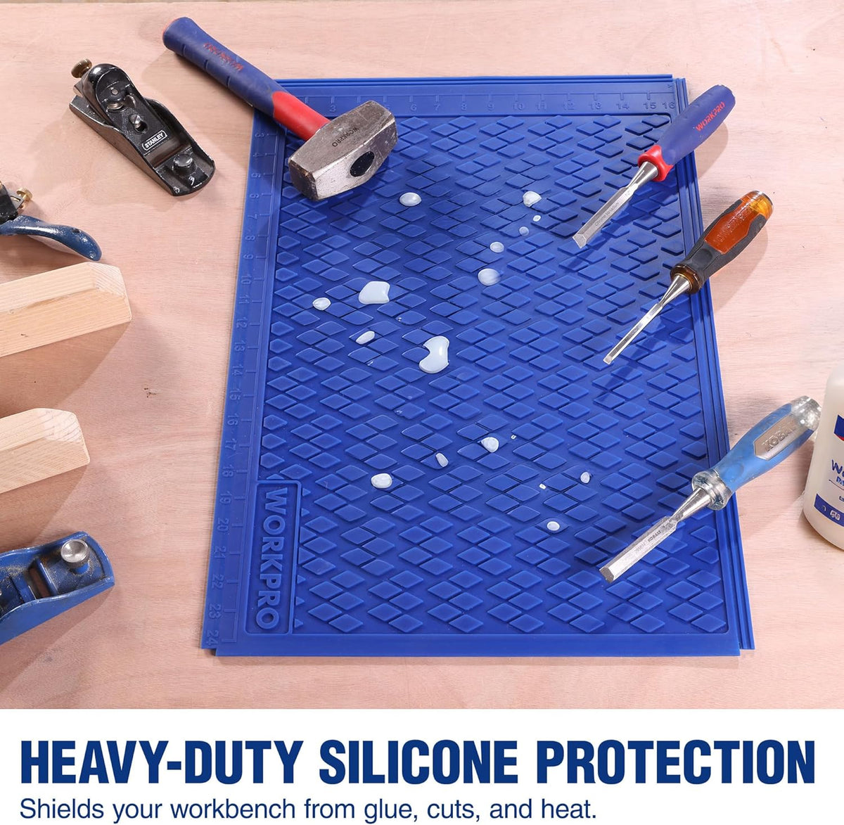 Blue silicone mat with diamond-textured grip, flat on workbench with tools