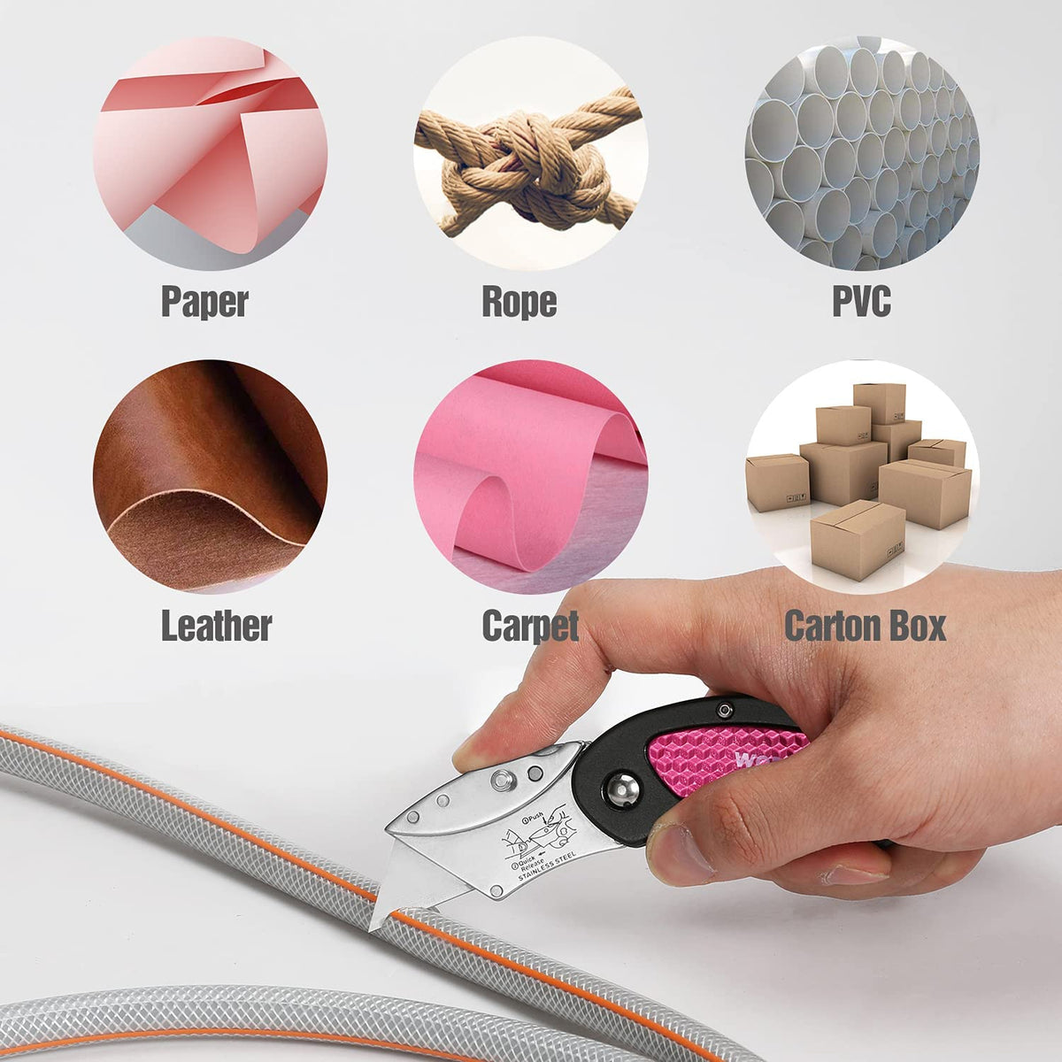 Pink and black folding utility knife with textured pink grips, blades extended